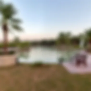 A serene lake surrounded by walking trails and benches in Mudon Park